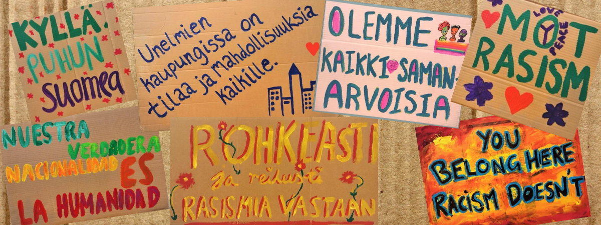 Rasisminvastaisia värikkäitä kylttejä.